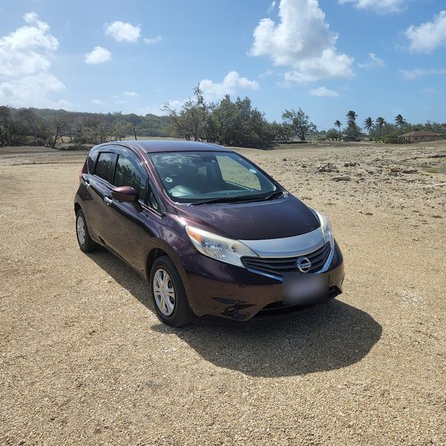 Nissan Note on a beach track